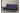 My Furniture dark wood frame futon sofa with navy blue tufted mattress, convertible to a bed.